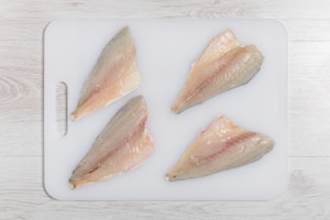 Preparazione Penne con orata, zucchine e pomodorini - Fase 1