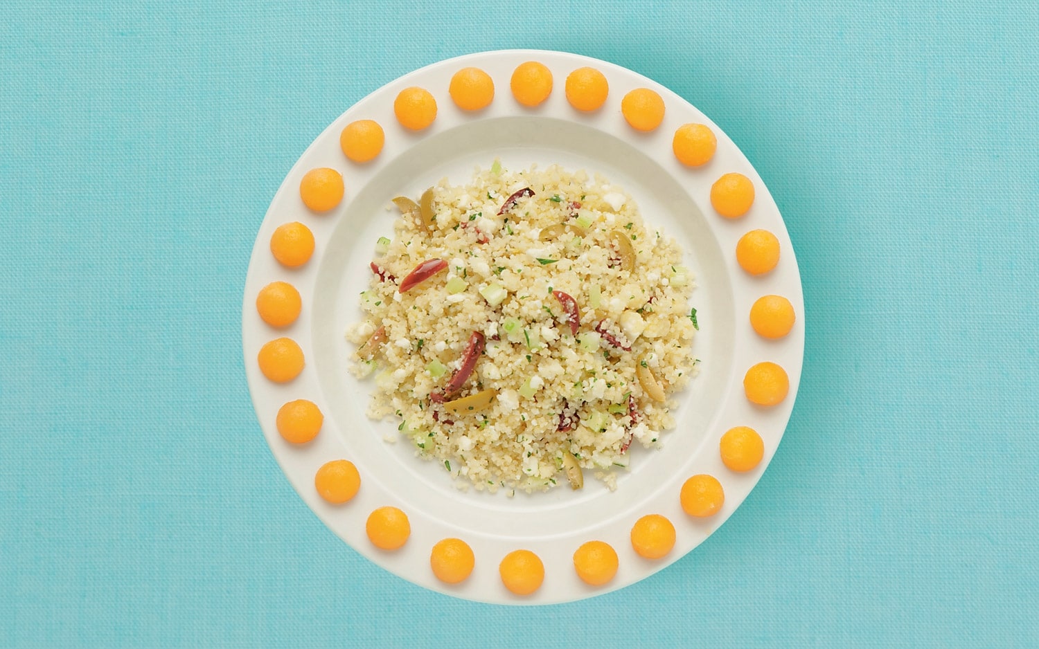 Couscous con olive, feta e melone ricetta