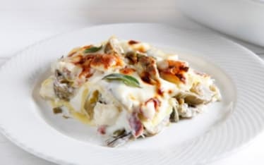Lasagne ai carciofi, taleggio e pancetta arrotolata