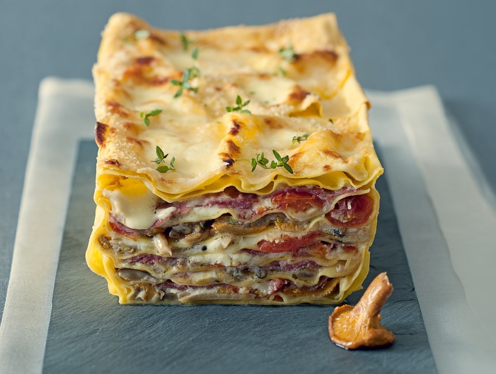 Terrina di lasagne ai funghi con pomodorini confit ricetta