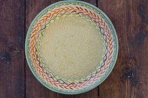 Preparazione Tajine di pollo speziato con cous cous ai ceci, uvetta ed erbette - Fase 3