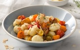 Gnocchi con pomodorini confit, timo e mandorle a scaglie