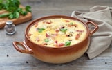 Polenta concia con formaggio e speck