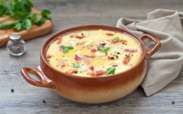 Polenta concia con formaggio e speck