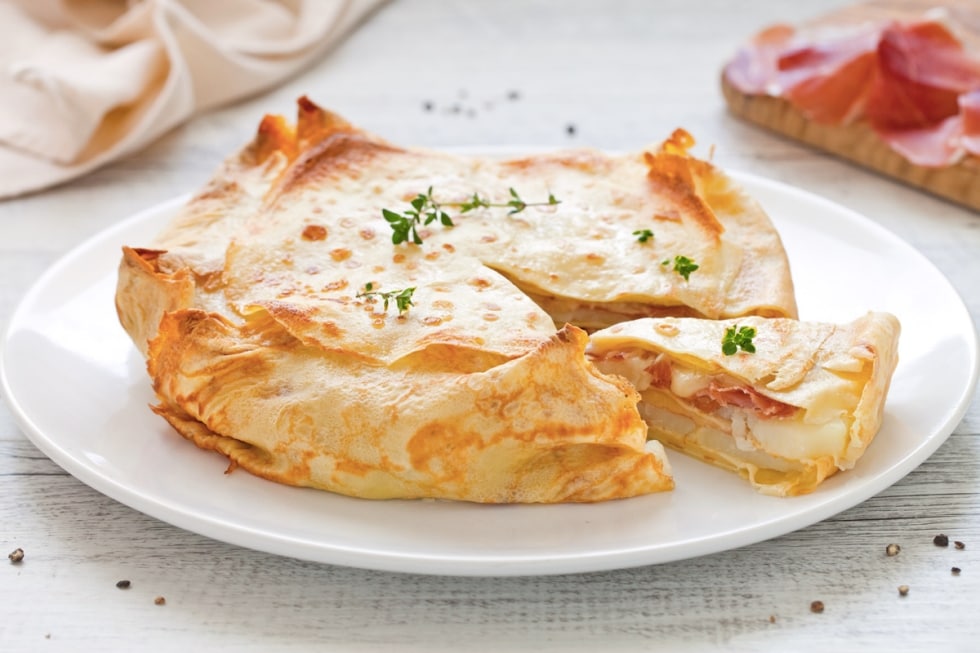 Gratin di crepes al prosciutto e fontina ricetta