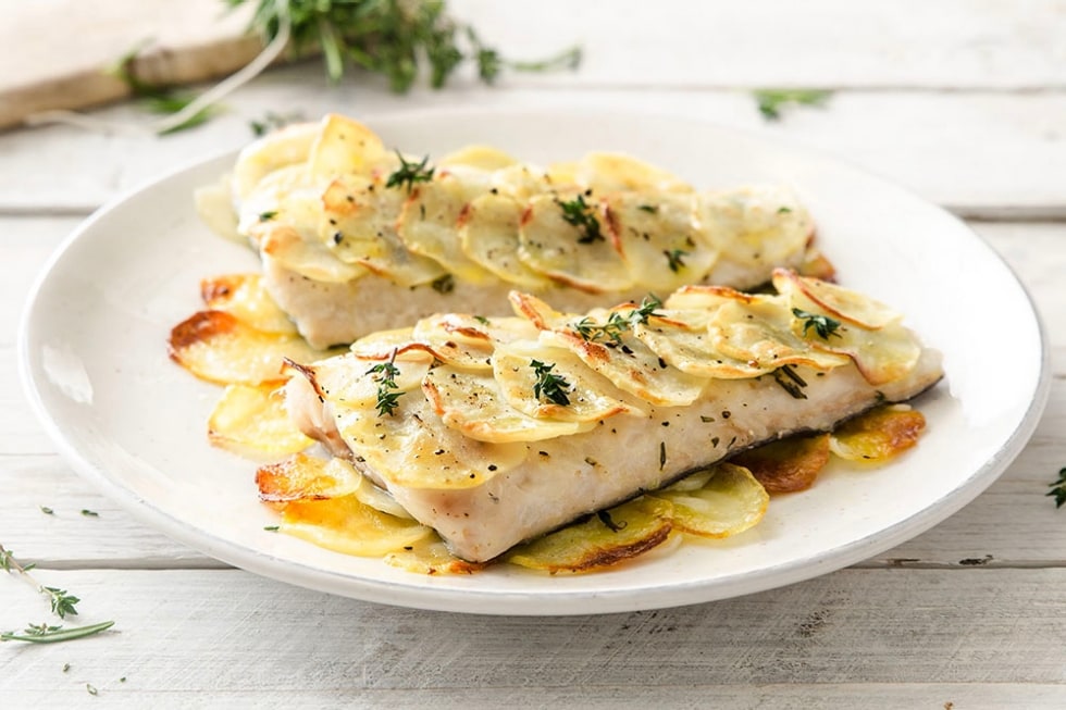 Tranci di nasello al forno con patate ricetta