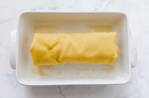 Preparazione Rotolo di pasta all'uovo ripieno con melanzane, prosciutto cotto e scamorza - Fase 4