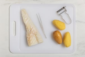 Preparazione Stoccafisso con patate, pomodorini e olive taggiasche  - Fase 1